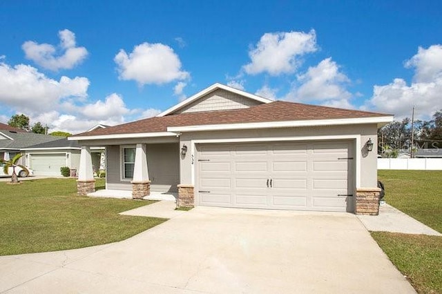 view of front facade featuring a garage, covered porch, and a front yard