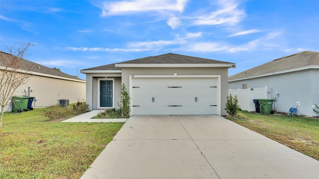 view of front of house featuring cooling unit, a garage, and a front lawn