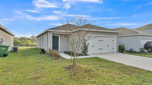 view of front of property with cooling unit, a garage, and a front lawn