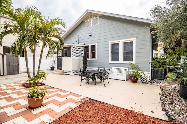 back of property with a patio area