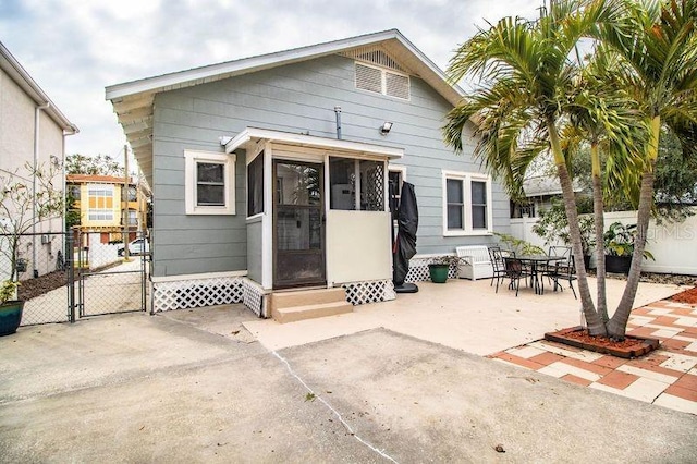 back of property featuring a patio