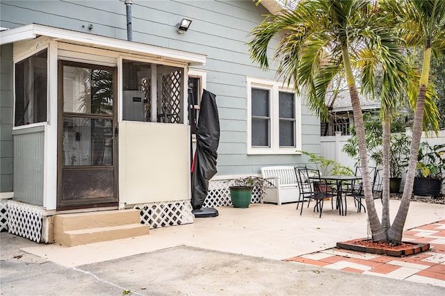 doorway to property with a patio