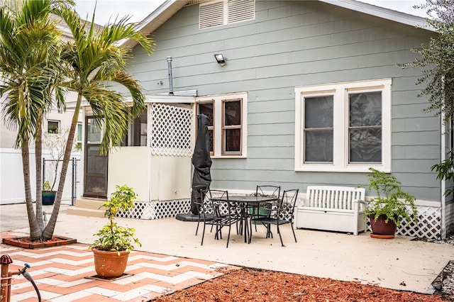 back of house with a patio