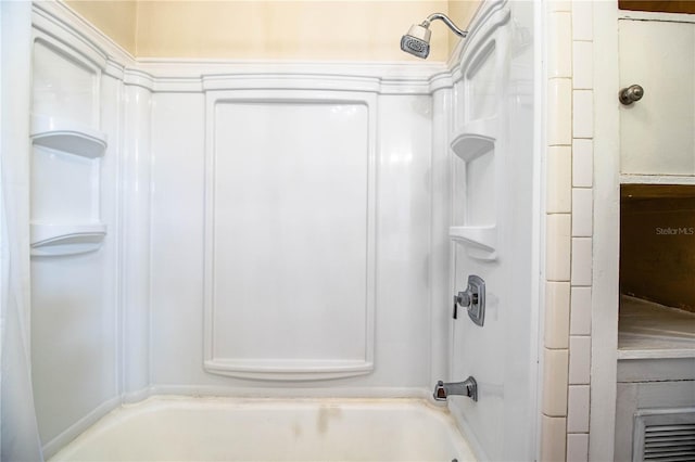 bathroom with shower / washtub combination