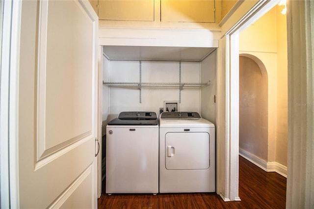 laundry room featuring dark hardwood / wood-style flooring and independent washer and dryer