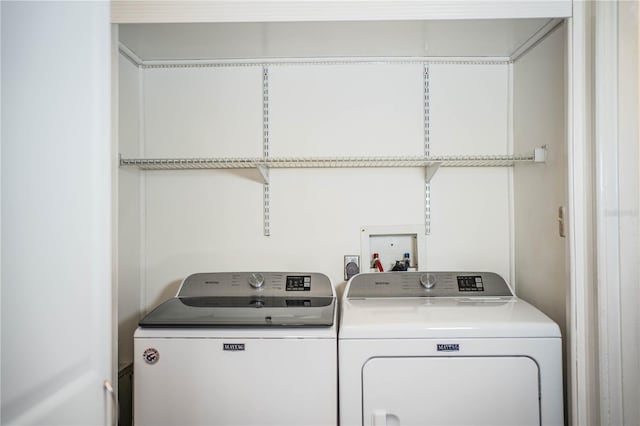 laundry room featuring washing machine and dryer