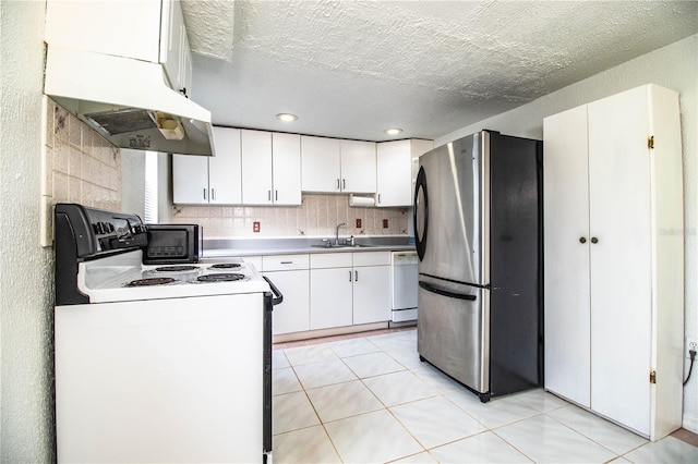 kitchen with stainless steel fridge, ventilation hood, electric range oven, and white cabinets