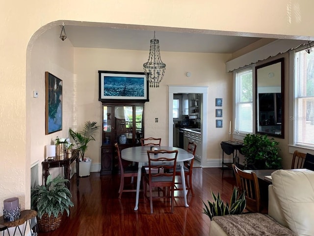 1919 W N A St, Tampa, FL 33606 - dining room with dark wood-type flooring, a notable chandelier, and baseboards