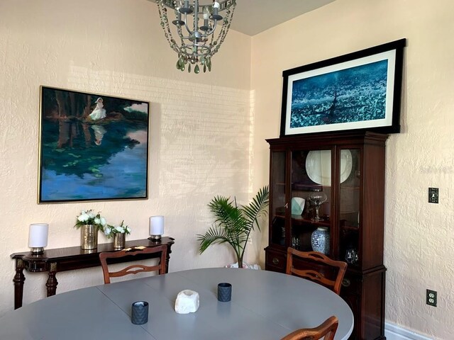 1919 W N A St, Tampa, FL 33606 - dining space with a notable chandelier and a textured wall