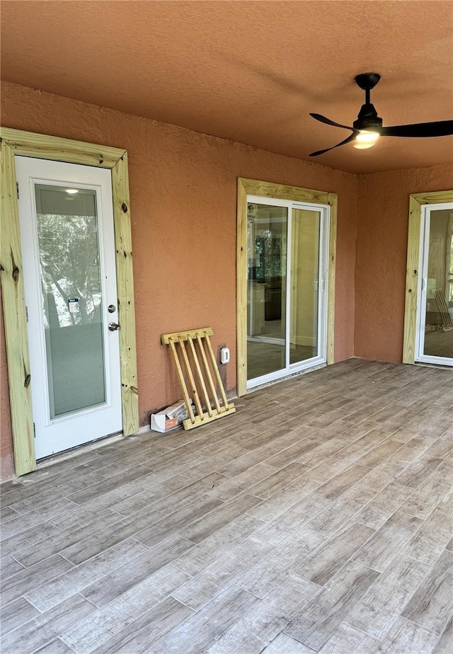 view of patio / terrace with a ceiling fan and a wooden deck