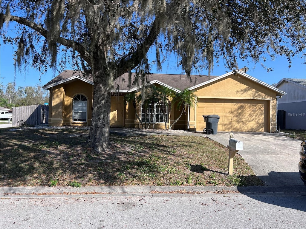 ranch-style home with a garage