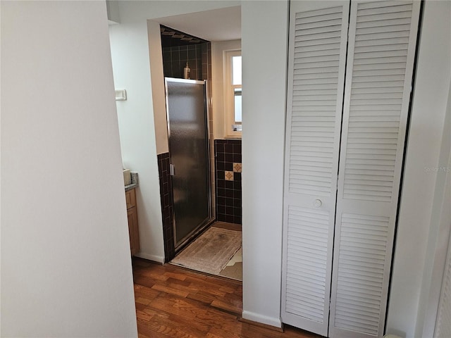 corridor featuring dark hardwood / wood-style floors