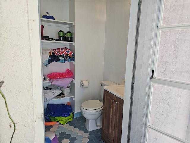 bathroom with vanity and toilet