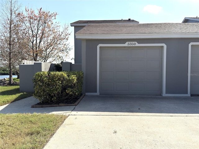 garage featuring driveway