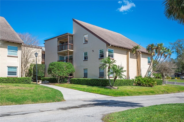 view of property exterior featuring a yard