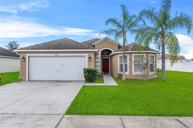 ranch-style house featuring concrete driveway, a front lawn, fence, and stucco siding