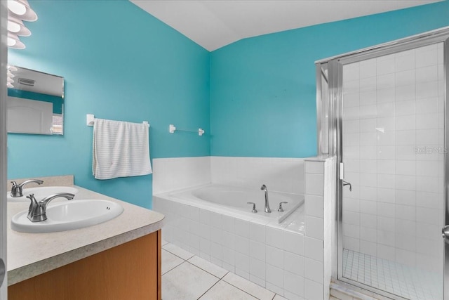 bathroom with tile patterned flooring, a sink, a shower stall, a bath, and double vanity