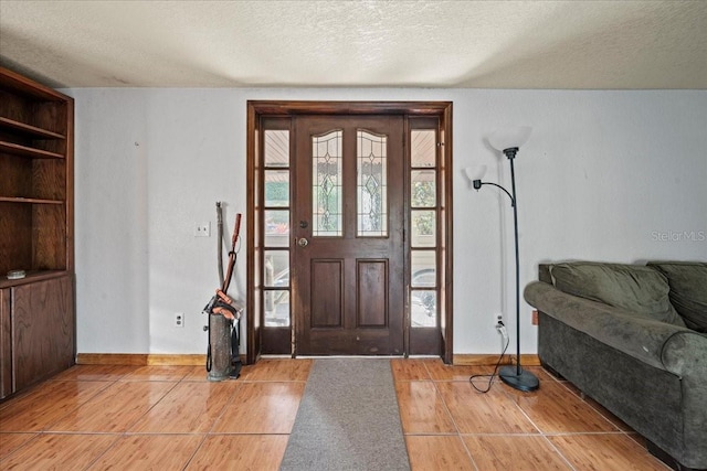 entryway featuring hardwood / wood-style flooring and a textured ceiling