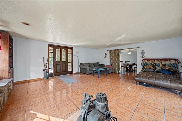 interior space featuring tile patterned floors and a textured ceiling