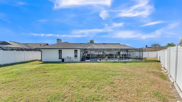 rear view of house featuring a pool, a lawn, and glass enclosure