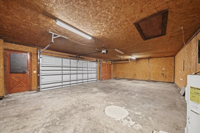 garage featuring a garage door opener and water heater