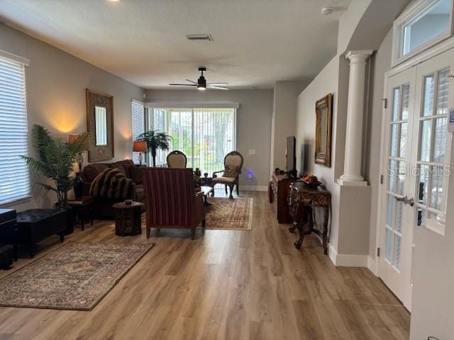 8623 Snowy Owl Way, Tampa, FL 33647 - entryway with ceiling fan, decorative columns, and light wood-style floors
