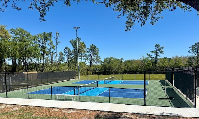 8623 Snowy Owl Way, Tampa, FL 33647 - view of sport court with a tennis court, fence, and community basketball court