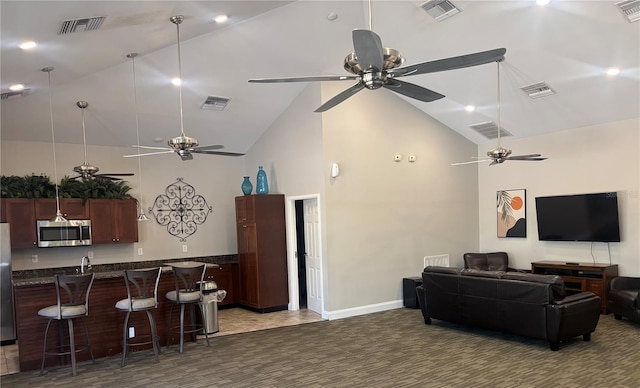 8623 Snowy Owl Way, Tampa, FL 33647 - living room with high vaulted ceiling, a ceiling fan, and visible vents