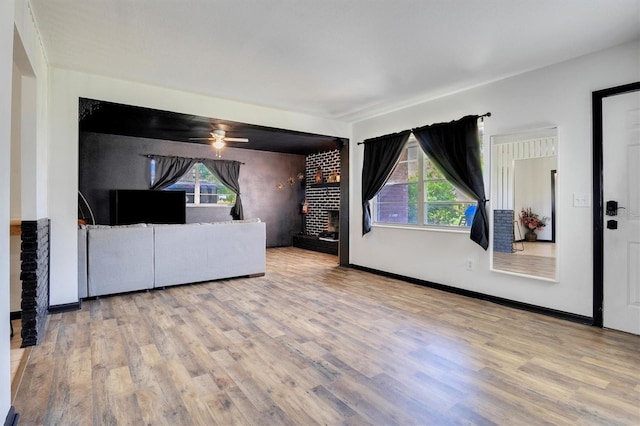 unfurnished living room with light hardwood / wood-style flooring