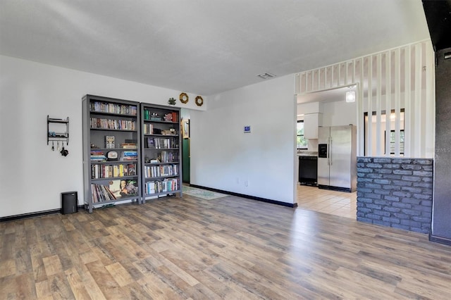 unfurnished room featuring light wood-type flooring