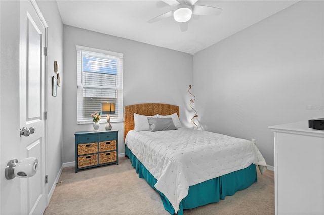 bedroom featuring a ceiling fan, carpet, and baseboards