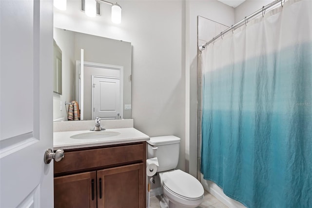 bathroom featuring toilet and vanity