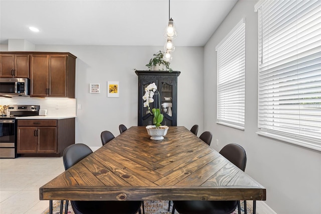 dining area featuring light tile patterned floors