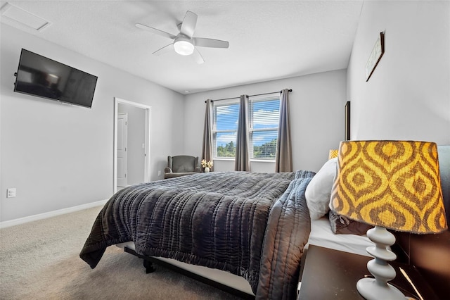 bedroom with visible vents, a ceiling fan, baseboards, and carpet floors