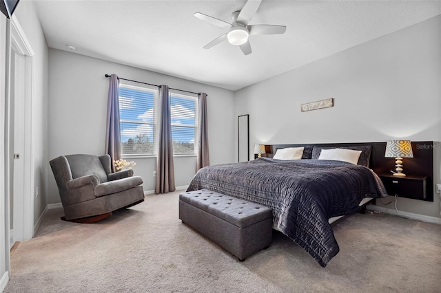 bedroom featuring baseboards, carpet, and a ceiling fan