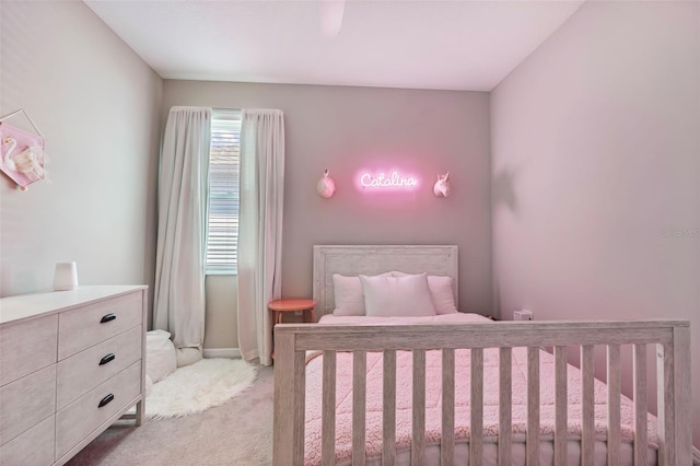 bedroom featuring baseboards and carpet floors