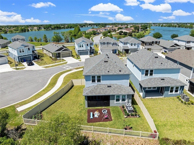 bird's eye view with a residential view and a water view