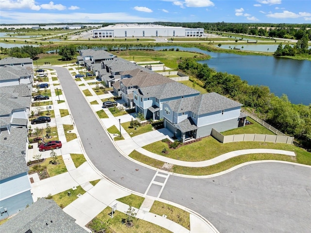 birds eye view of property with a residential view and a water view