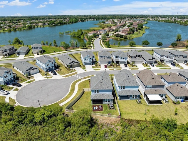 birds eye view of property featuring a residential view and a water view