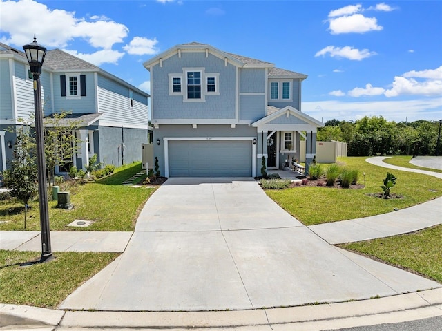 view of front of home with a front lawn, a garage, and driveway