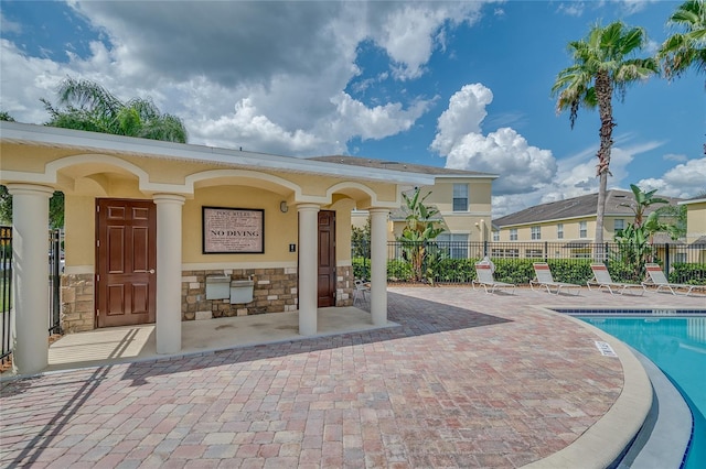 exterior space with fence and a patio