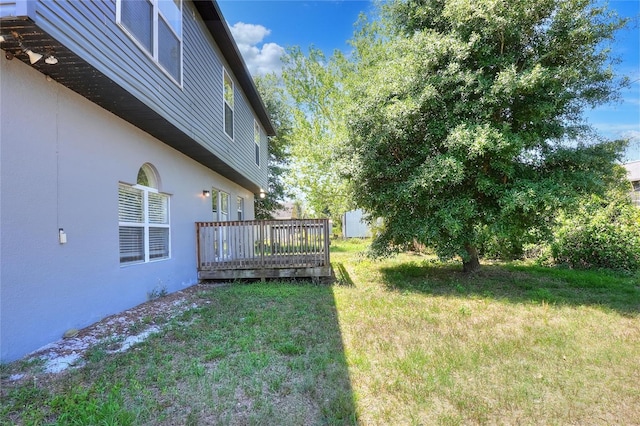 view of yard with a deck