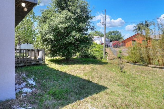 view of yard featuring a wooden deck