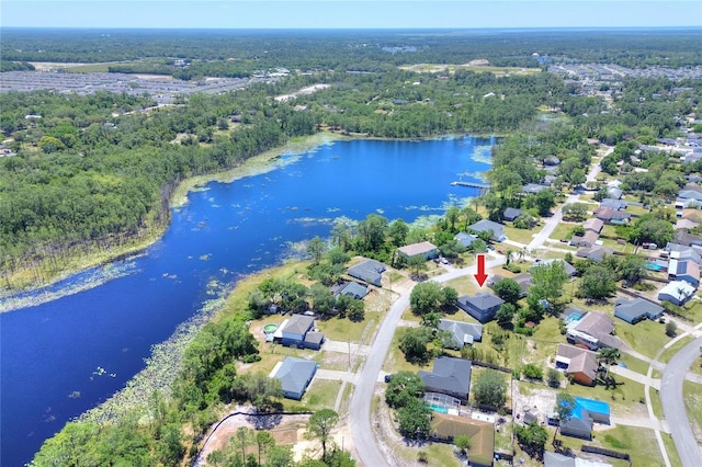 birds eye view of property with a residential view, a forest view, and a water view
