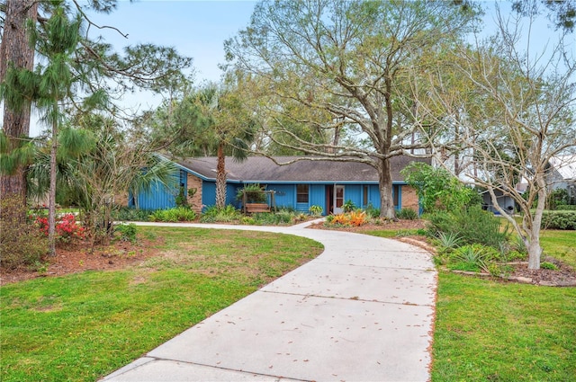 single story home featuring a front yard