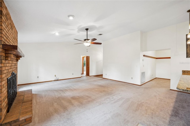 unfurnished living room featuring ceiling fan, vaulted ceiling, carpet floors, and a brick fireplace