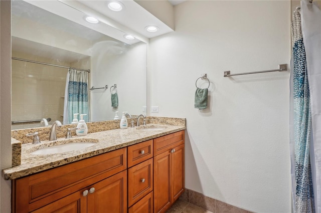 bathroom featuring tile patterned flooring, a shower with shower curtain, and vanity