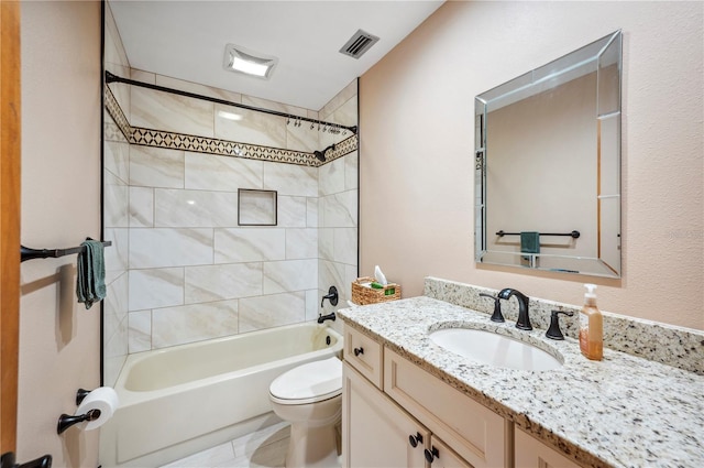 full bathroom with toilet, vanity, and tiled shower / bath combo