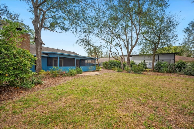 view of yard with a sunroom