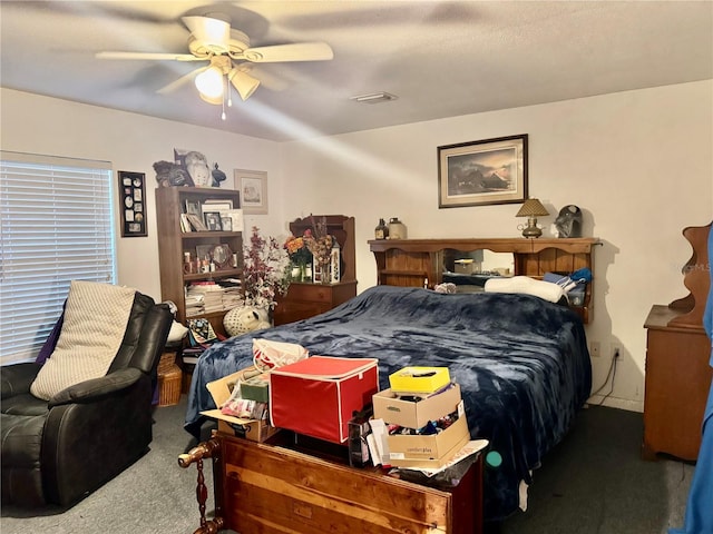 bedroom featuring ceiling fan and carpet flooring